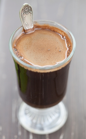 Close up of a glass with freshly made coffeeの写真素材