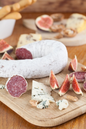 Meat with cheese, figs, nuts and grissiniの写真素材