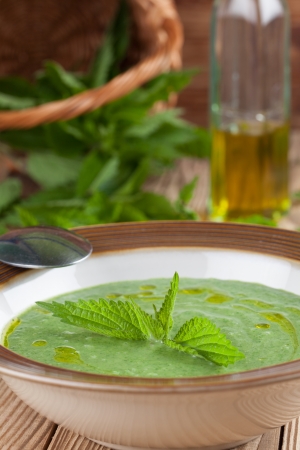 Nettle cream soup on wooden Shallow dofの写真素材