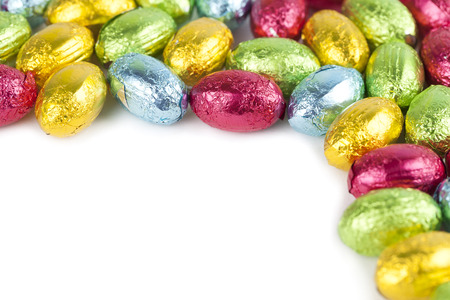 Chocolate Easter eggs frame isolated on white の写真素材