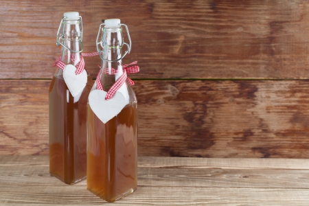 Bottles with freshly made elderberry syrup, alternative medicine for cough, cold or flu.の写真素材