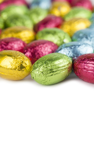 Background made from colorful chocolate Easter eggsの写真素材