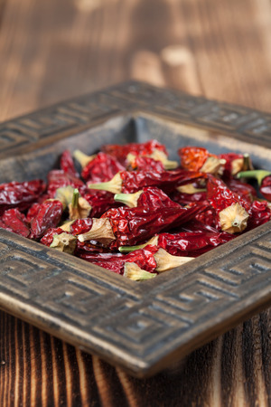 Dried red chili peppers in a bowl. Shallow dofの写真素材