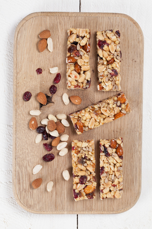 Granola bars with various nuts, seeds and cranberriesの写真素材
