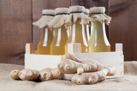 Bottles with homemade ginger syrup. Shallow dofの写真素材