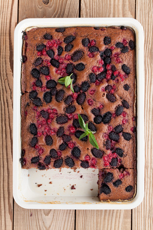 Gingerbread cake with mulberries and red currants. Shallow dofの写真素材