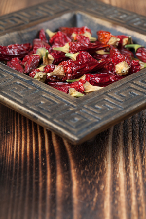 Dried red chili peppers in a bowl. Shallow dofの写真素材