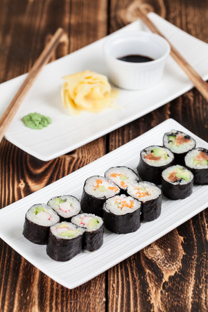 Maki sushi set with ginger, wasabi and soy sauce. Shallow dofの写真素材