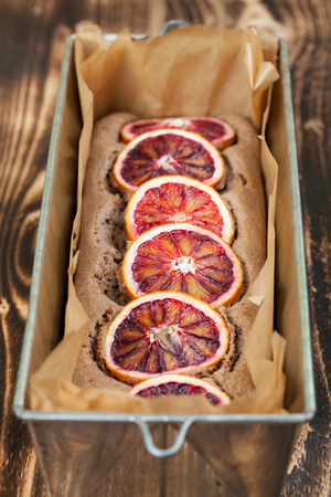 Healthy and delicious spelt cake with blood orangesの写真素材