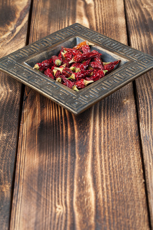 Dried red chili peppers in a bowl. Shallow dofの写真素材