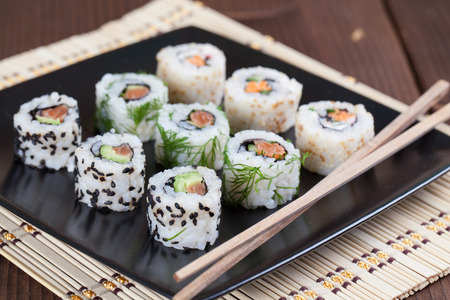 Uramaki sushi set on a plate. Shallow dofの写真素材