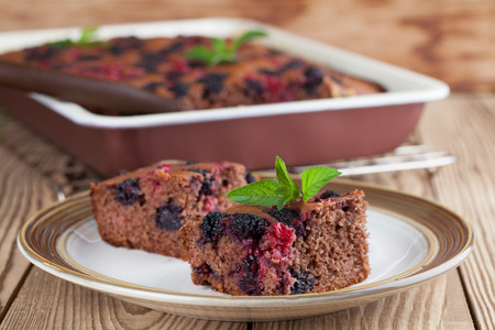 Gingerbread cake with mulberries and red currants. Shallow dofの写真素材