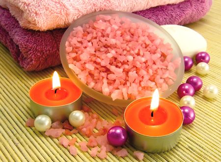 Salt with the aroma of rose oil, candle and bamboo towels for relaxの写真素材