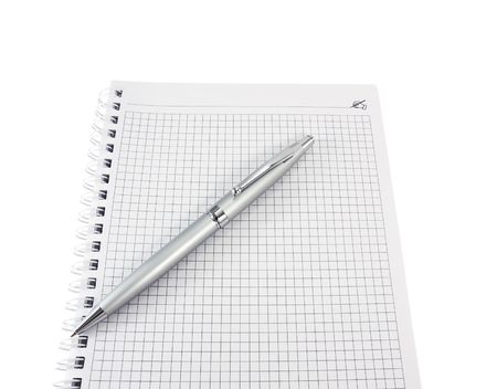 Open a notebook and pen for notes close-up on a white backgroundの写真素材