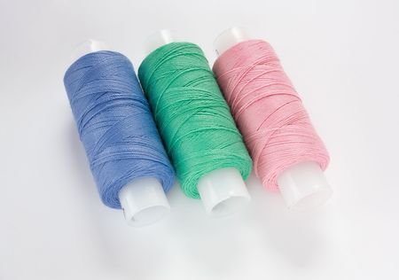 Colorful cotton threads in coils for sewing close-upの写真素材