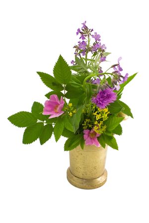 Old mortar and bouquet of herb on a white close-upの写真素材