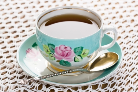 Porcelain cup of tea with silver-gold spoon and saucer
の写真素材