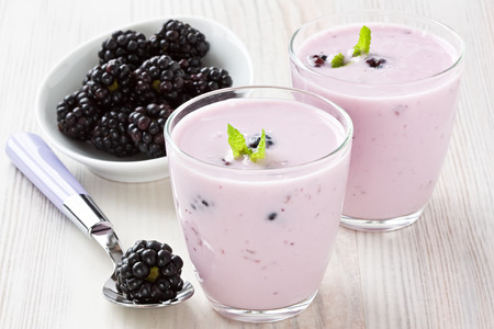 Fresh yogurt with sweet dewberry for healthy breakfastの写真素材