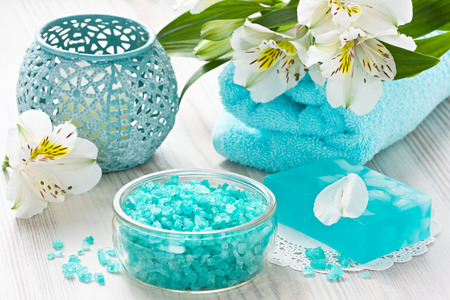 Aroma SPA set with sea salt, natural soap, soft towel and flower on wooden backgroundの写真素材