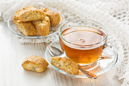Transparent cup herbal tea with homemade cantuccini cookiesの写真素材