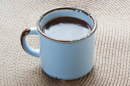 Hot chocolate in blue rustic mug for winter drinkの写真素材