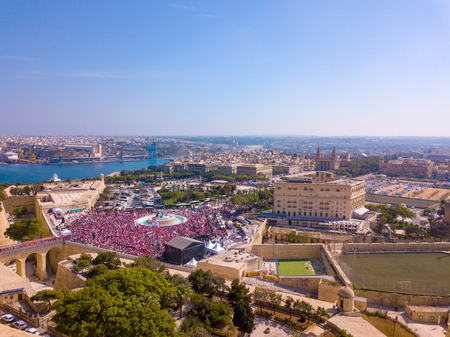 Celebrating labour day in Valletta, Malta. Aerial view on the people crowd celebrating workers day on the 1st of May.の写真素材