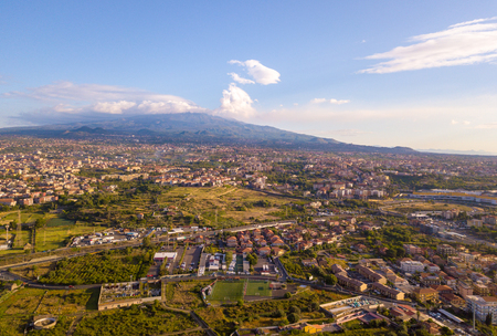 Beautiful aerial view of the Catania city near the main Cathedral and Etna volcano on the background. Amazing old town view from above.の写真素材