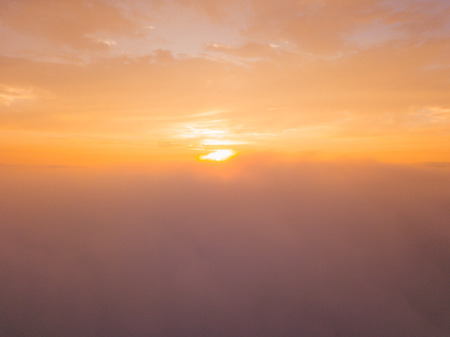Aerial sunset aerial view of the Golden Gate bridge in San Francisco above the clouds. Romantic...