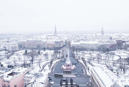 RIGA - 20 January, 2018: Aerial View of the Statue of Liberty Milda in Riga, Latvia during Memorial Day defenders of the barricades in 1991. Beautiful snowy winter day. Latvia.のeditorial素材