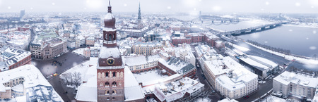 Amazing aerial view of the Riga old town (vecriga) in January during barracades memorial winter day. Snowing in Latvia.のeditorial素材