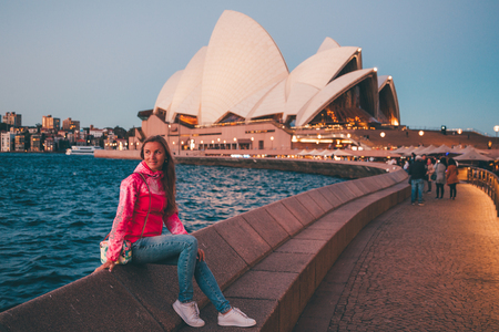 Beautiful Sydney Opera house during sunset by the bay bridge and with people walking by. Sydney, Australia. August 30, 2017.のeditorial素材