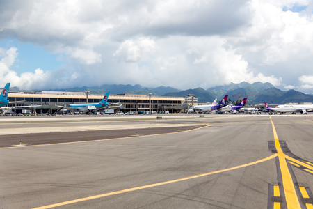 Runway with large planes in the Honolulu international Airport. Hawaii, USA. August 30, 2017.のeditorial素材
