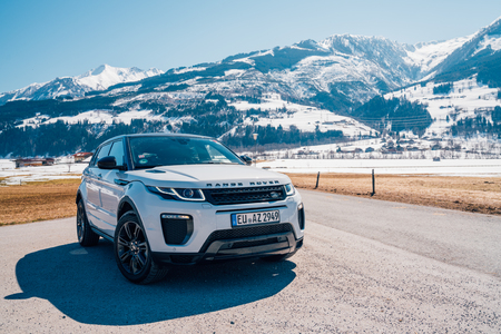 White Range Rover Evoque. Austria, Alps - March 25, 2018: Latest brand new white 2018 Range Rover Evoque. Beautiful car SUV in the nature deep in Alps. Range Rover bestselling model in the wild.のeditorial素材