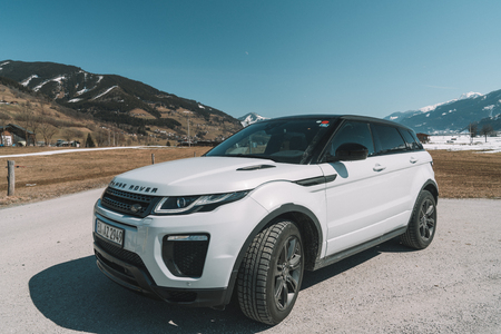 White Range Rover Evoque. Austria, Alps - March 25, 2018: Latest brand new white 2018 Range Rover Evoque. Beautiful car SUV in the nature deep in Alps. Range Rover bestselling model in the wild.のeditorial素材