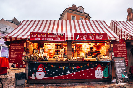 Christmas market and the main Christmas tree located at the Dome square in old Riga, Latvia. Fireworks over the old town of Riga.のeditorial素材