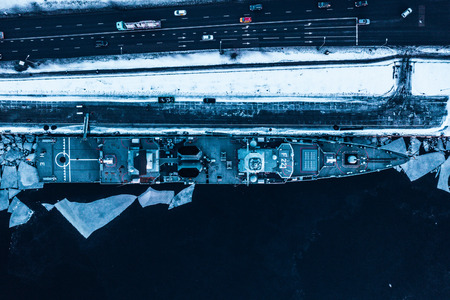 January 25, 2019. Riga, Latvia. The German frigate F 221 "Hessen" visiting Riga, Latvia docked near the old town in the icy cold river. Sunset time.のeditorial素材