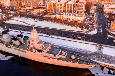 January 25, 2019. Riga, Latvia. The German frigate F 221 "Hessen" visiting Riga, Latvia docked near the old town in the icy cold river. Sunset time.のeditorial素材