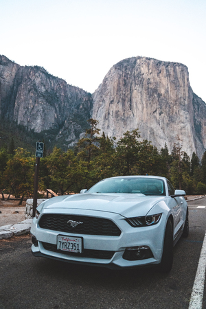 Yosemite National Park, USA. September 10, 2018. Beautiful white Ford Mustang GT parked in the heart...