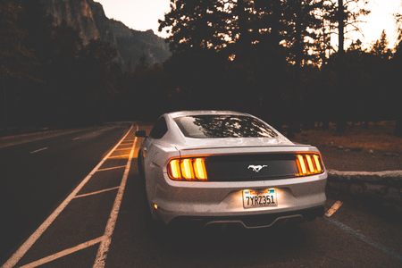 Yosemite National Park, USA. September 10, 2018. Beautiful white Ford Mustang GT parked in the heart...