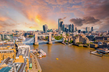 Tower Bridge in London, the UK. Bright day over London. Drawbridge opening.