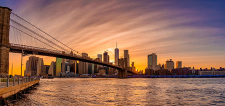 Magical sunset view of the Brooklyn Bridge. Empty bridge during lockdownの写真素材