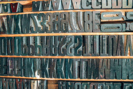 Old typography printing machine with letter samples.の写真素材