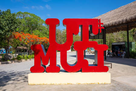Multi colored Tulum text sign in the city on a bright sunny dayのeditorial素材