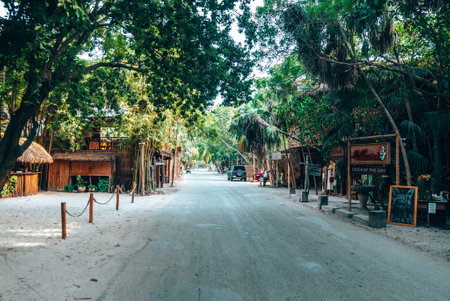 Restaurants and shops on both sides of an empty road near beachのeditorial素材
