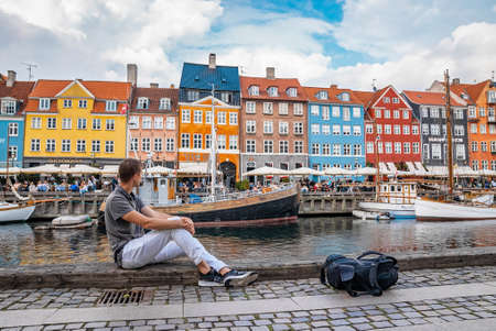 Famous Nyhavn pier with colorful buildings and boats in Copenhagen, Denmark.のeditorial素材