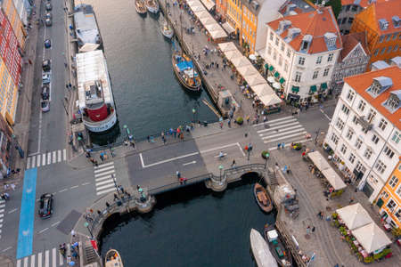 Famous Nyhavn pier with colorful buildings and boats in Copenhagen, Denmark.の写真素材