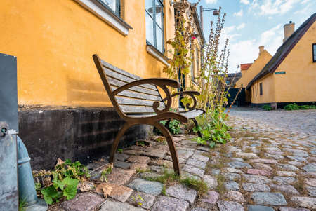 Beautiful, small, yellow rustic houses. Traditional Scandinavian style.の写真素材