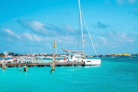 Yachts or sailboats sailing or moored at beautiful turquoise sea water surfaceのeditorial素材