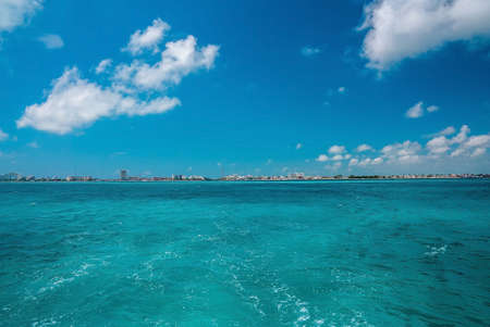 Scenic seascape with urban city buildings or hotels in distantの写真素材