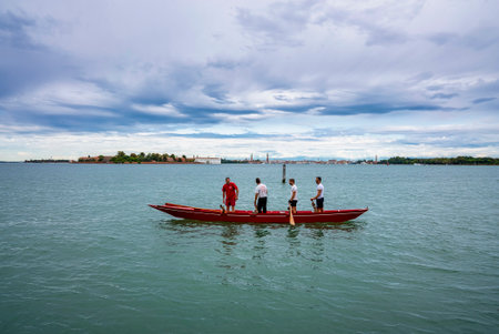 Male tourists traveling on river boat with residential town in distant